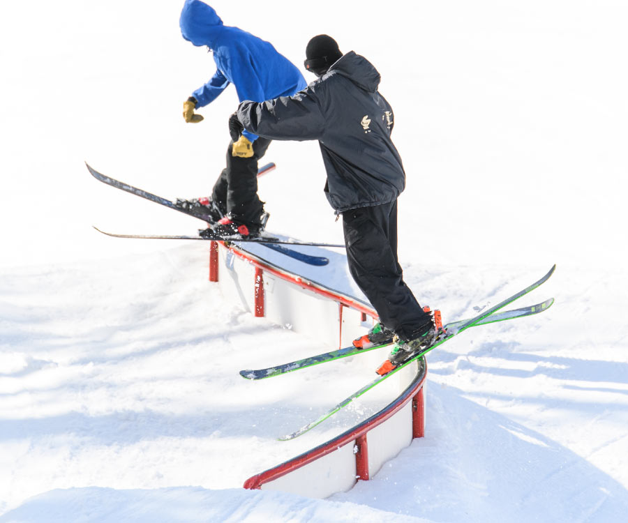 Skier son "S" rail in Stinger terrain park.