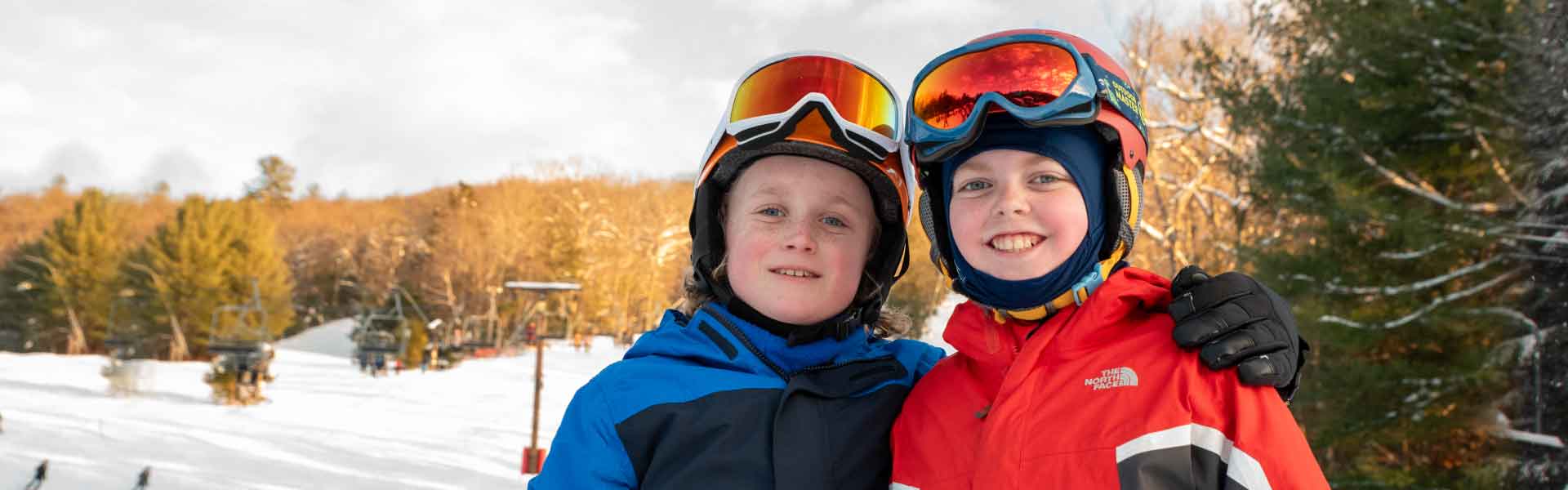 Two Terrain Park Adventures program participants. Boys and girls; skiers and snowboarders.